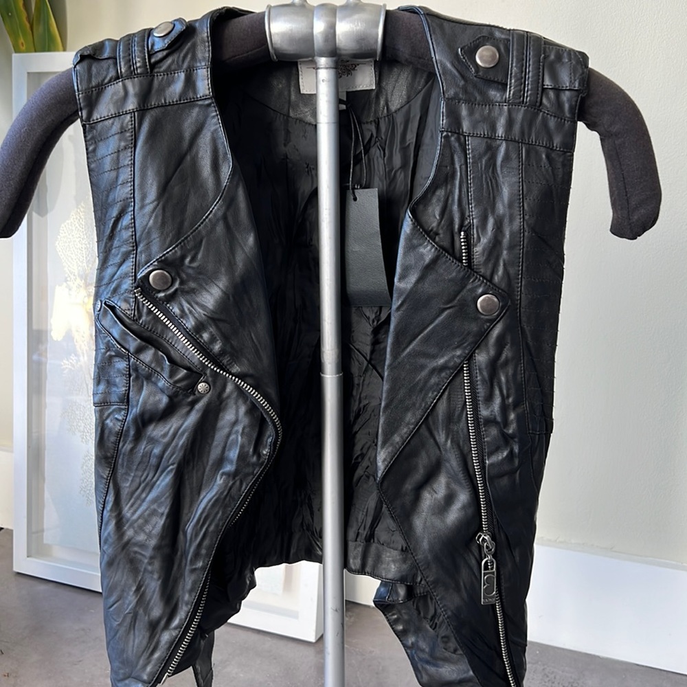 Faux leather vest, zips up and belt it for a chic fitted look.